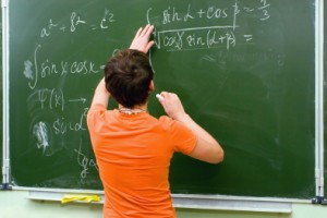 photo of boy at chalk board